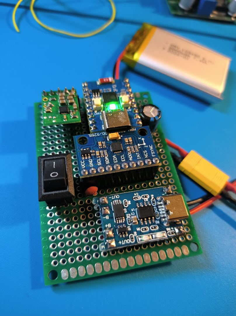 CyberGlove Phase 1 - ESP32 + MPU-6050 sensor node on perfboard, hand-soldered, powered via LiPo with LED indicator active